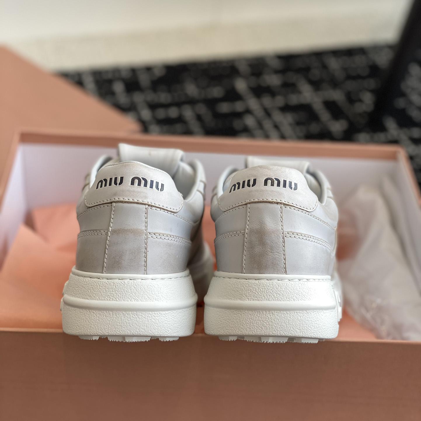 Miu Miu Bleached Leather Sneakers - DopestKickz