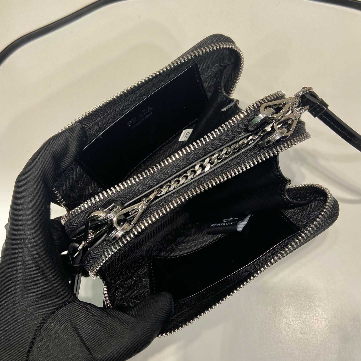 Prada Triangular Embellished Satin And Leather Mini-pouch - DopestKickz