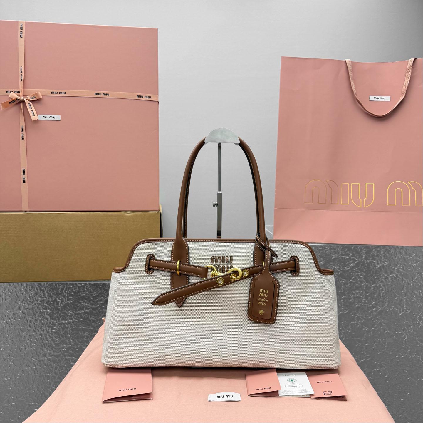 Miu Miu Aventure Canvas And Leather Bag - DopestKickz