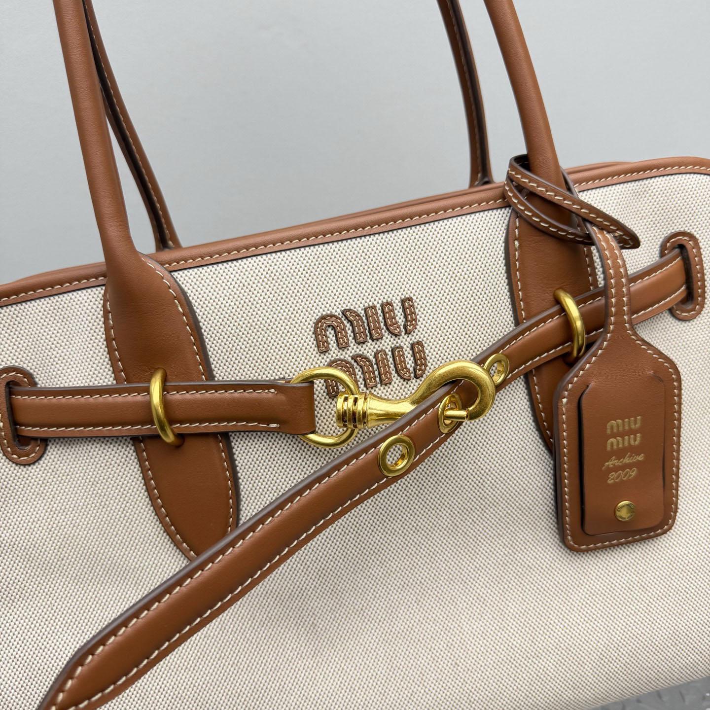 Miu Miu Aventure Canvas And Leather Bag - DopestKickz