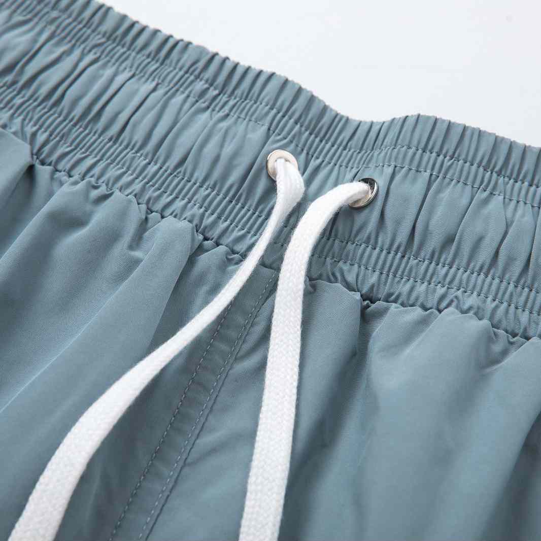Amiri Core Logo Swim Shorts Dusty Blue - DopestKickz