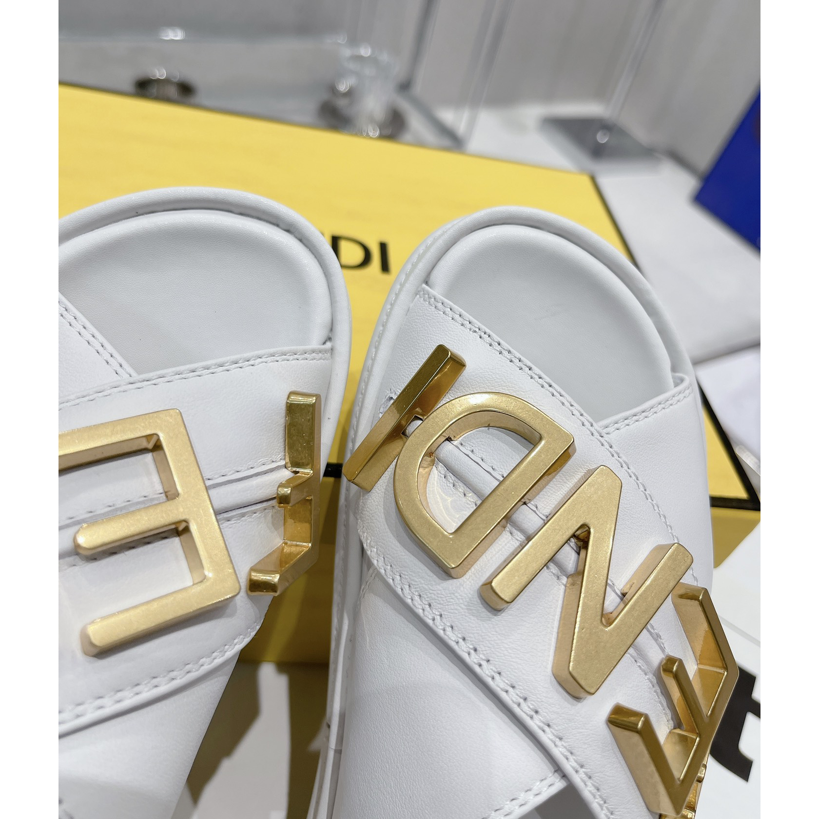 Fendi Graphy White Leather Slides - DopestKickz