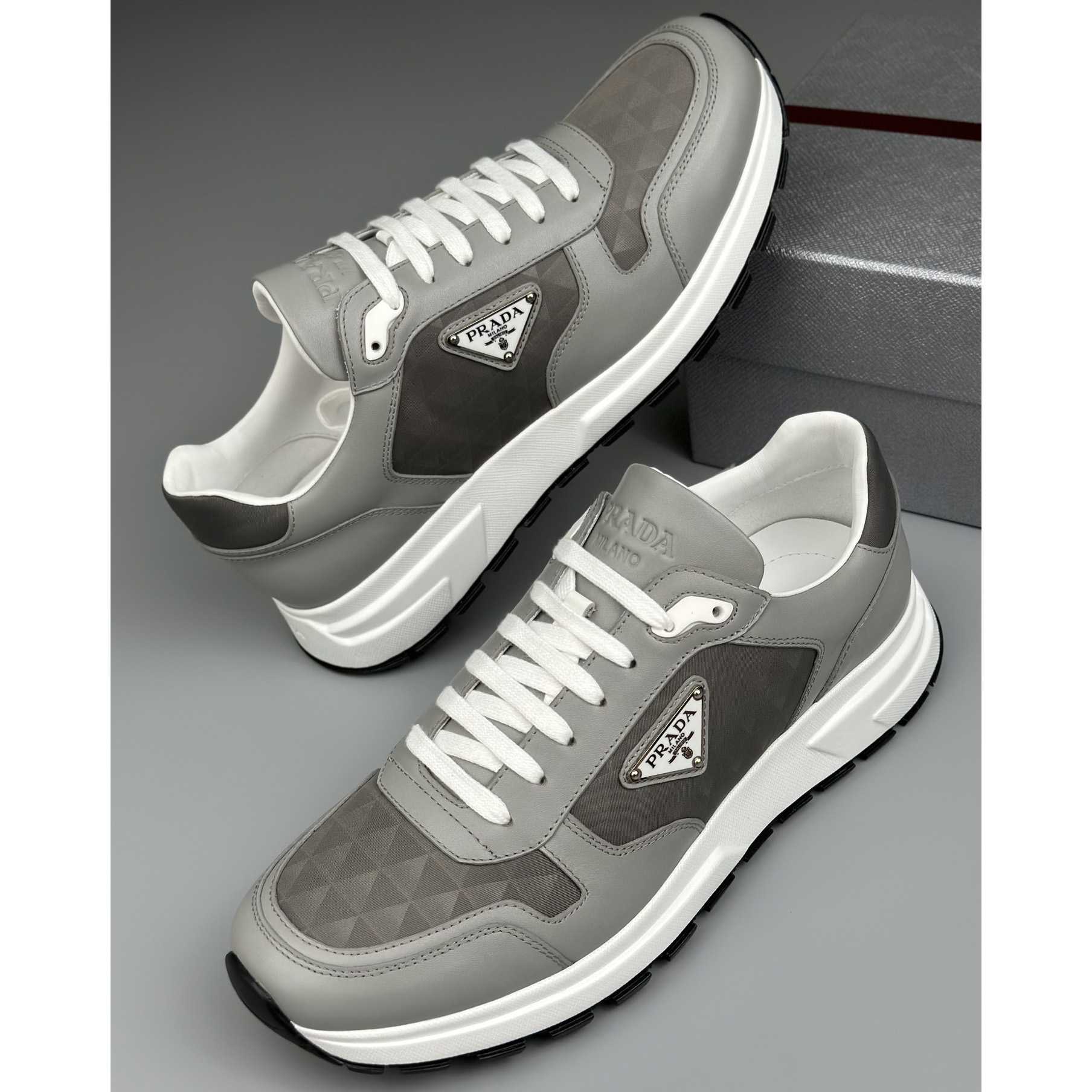 Prada Leather And Re-Nylon High-top Sneakers - DopestKickz