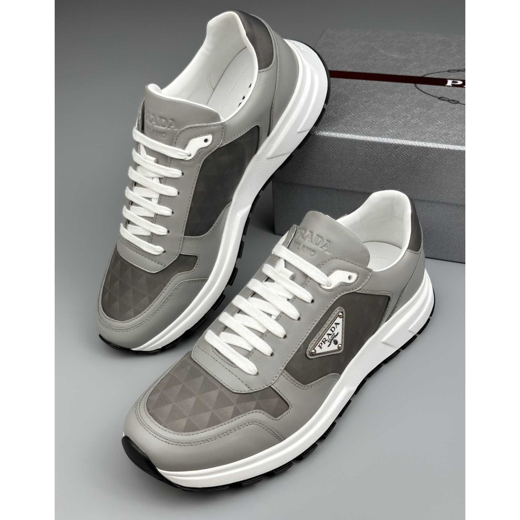 Prada Leather And Re-Nylon High-top Sneakers - DopestKickz