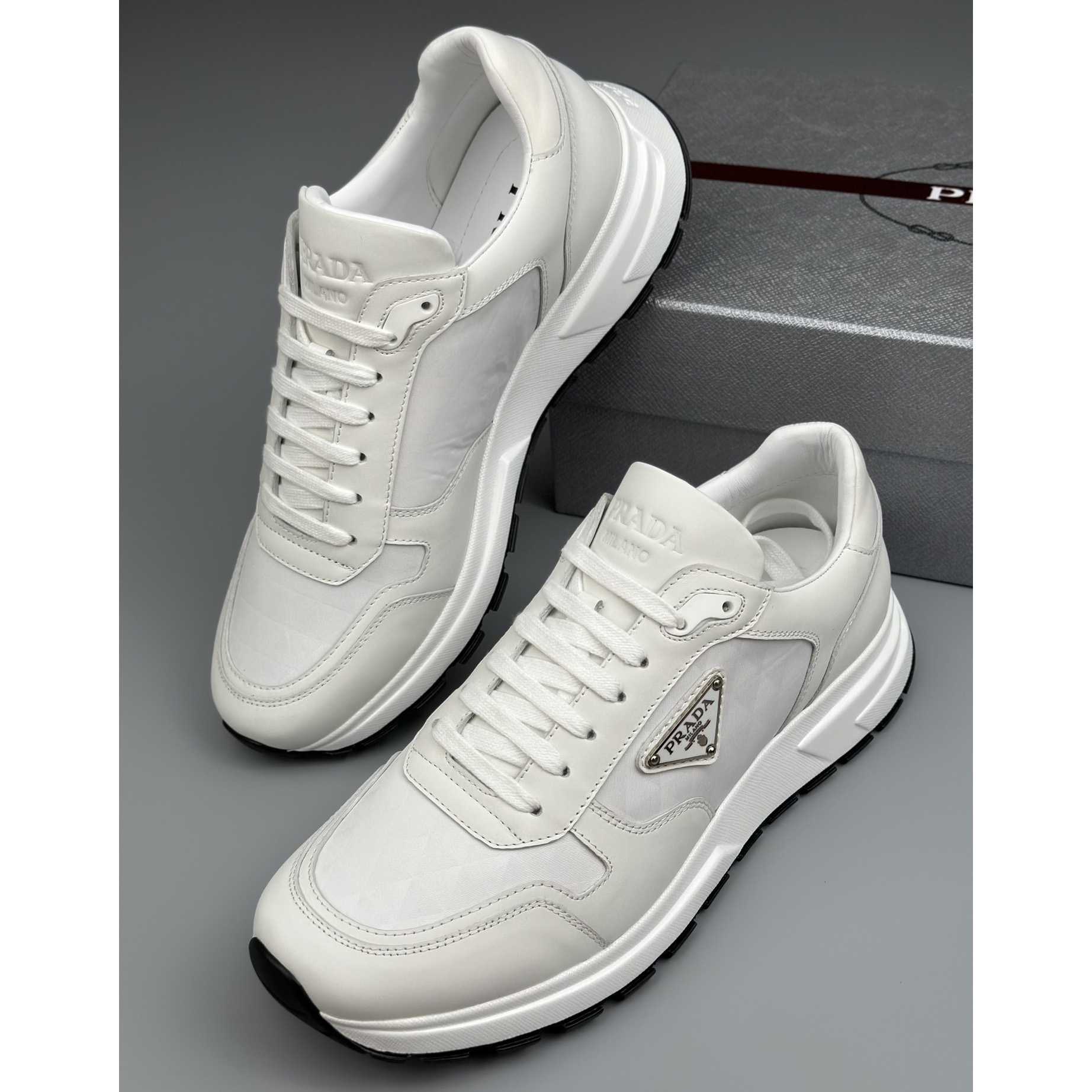 Prada Leather And Re-Nylon High-top Sneakers - DopestKickz