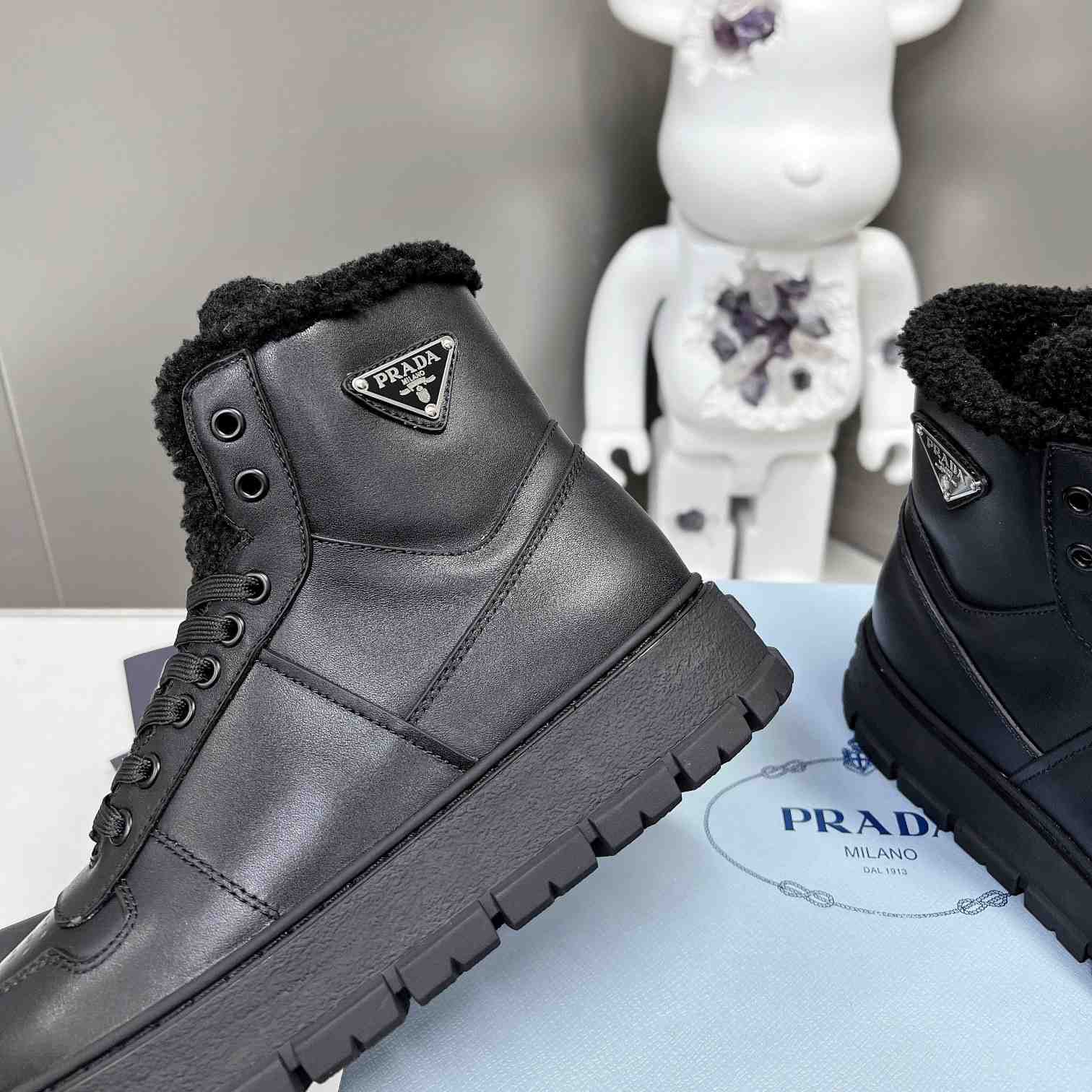 Prada Leather And Shearling High-top Sneakers - DopestKickz