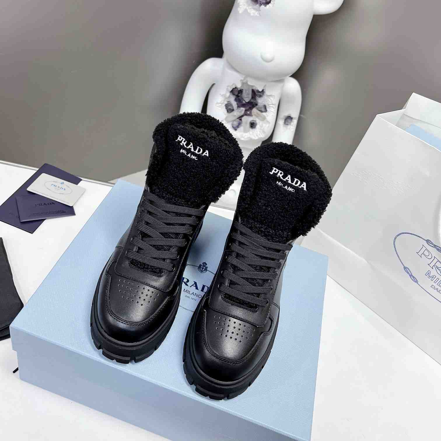 Prada Leather And Shearling High-top Sneakers - DopestKickz