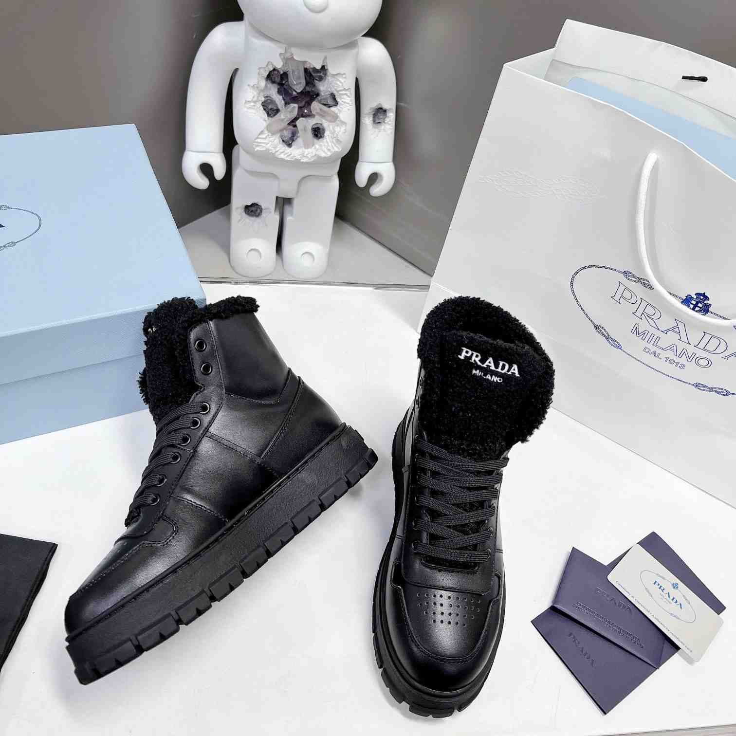 Prada Leather And Shearling High-top Sneakers - DopestKickz