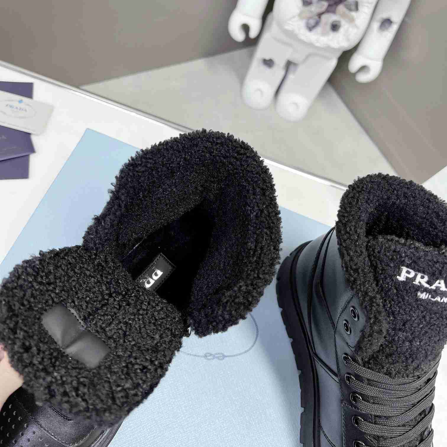 Prada Leather And Shearling High-top Sneakers - DopestKickz
