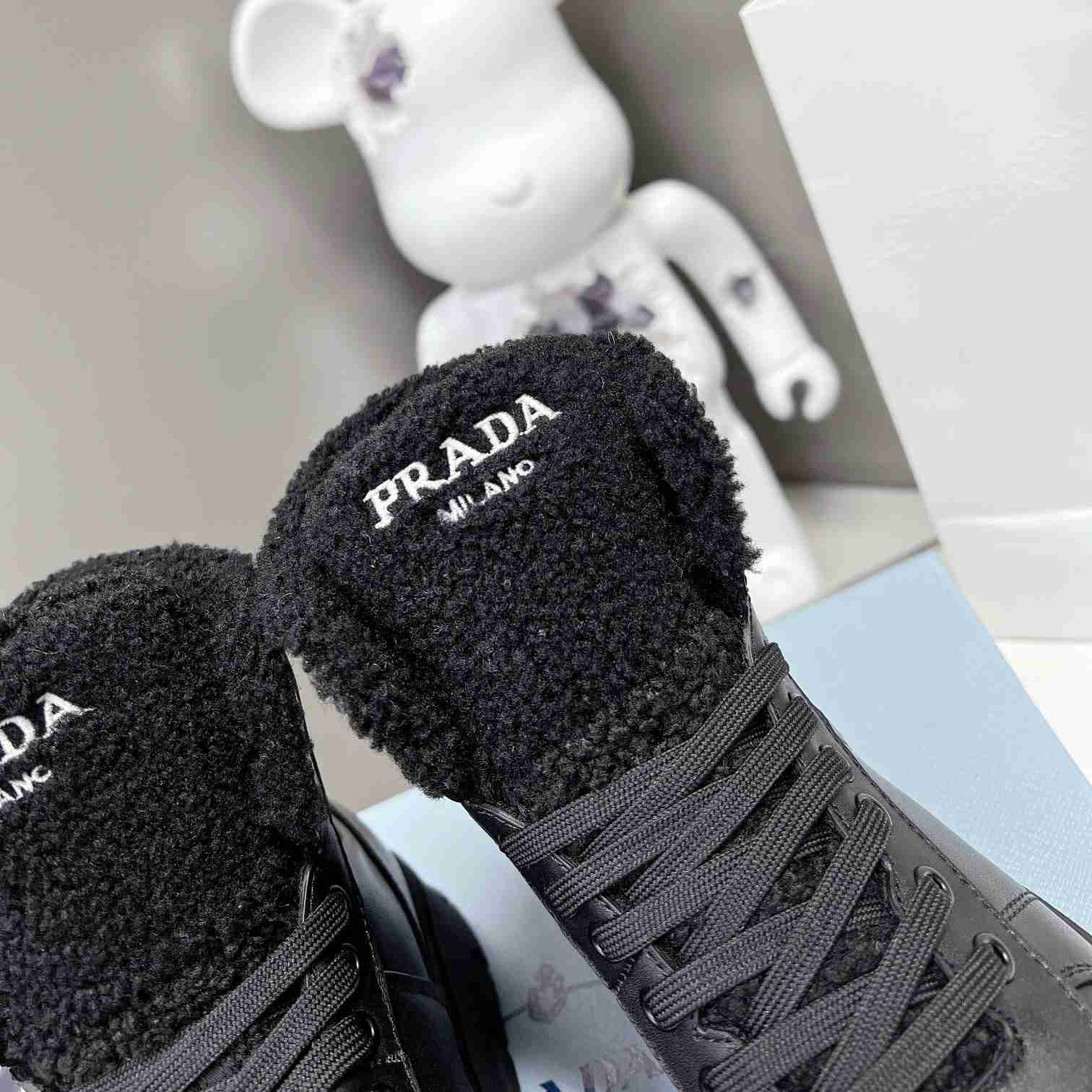 Prada Leather And Shearling High-top Sneakers - DopestKickz