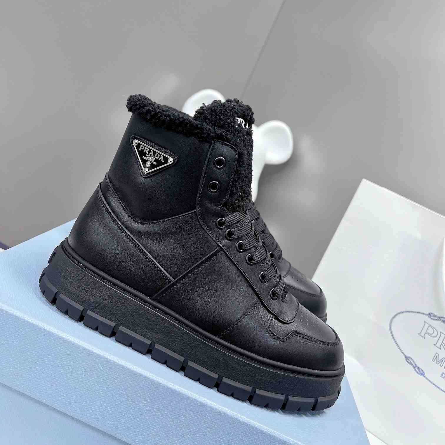 Prada Leather And Shearling High-top Sneakers - DopestKickz
