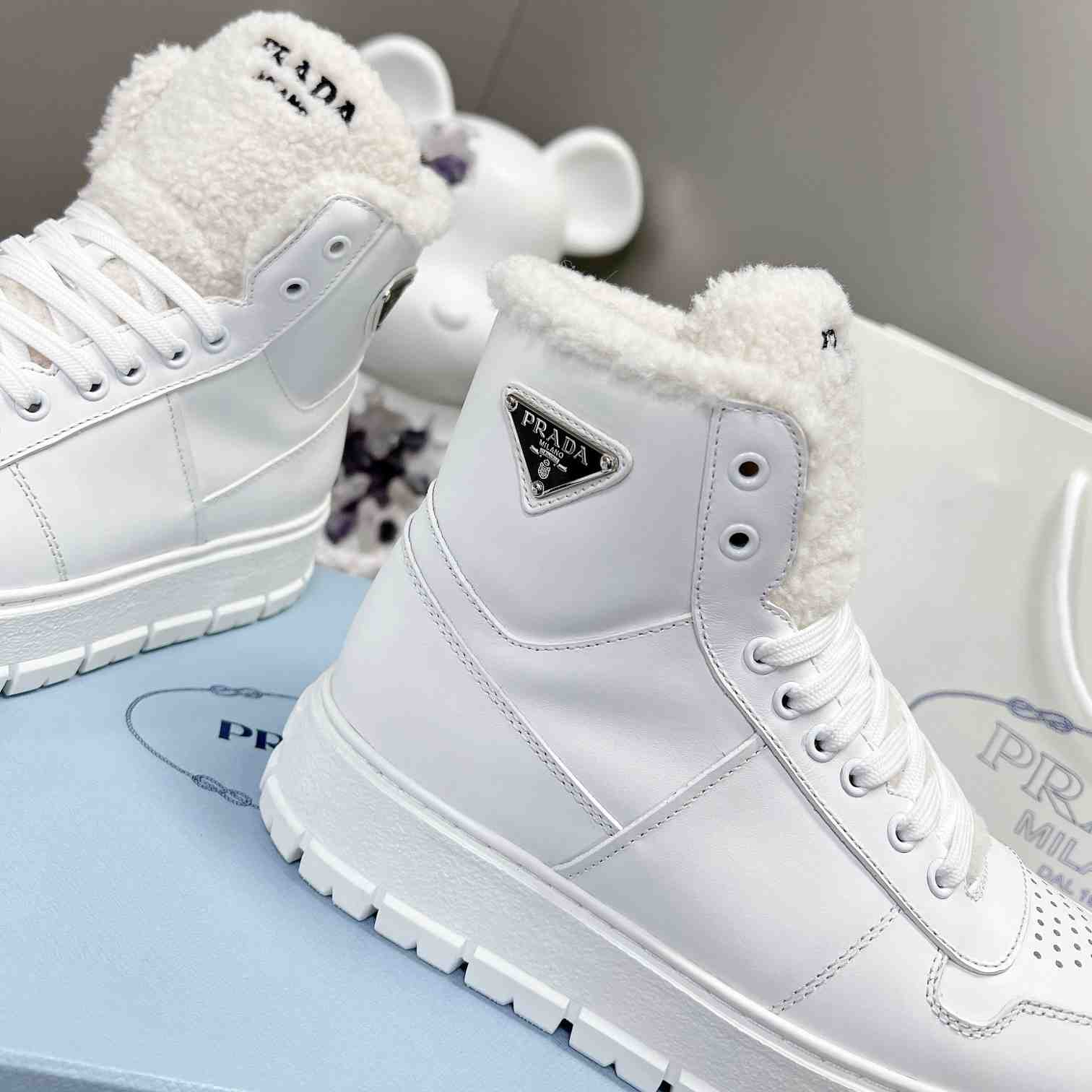 Prada Leather And Shearling High-top Sneakers - DopestKickz