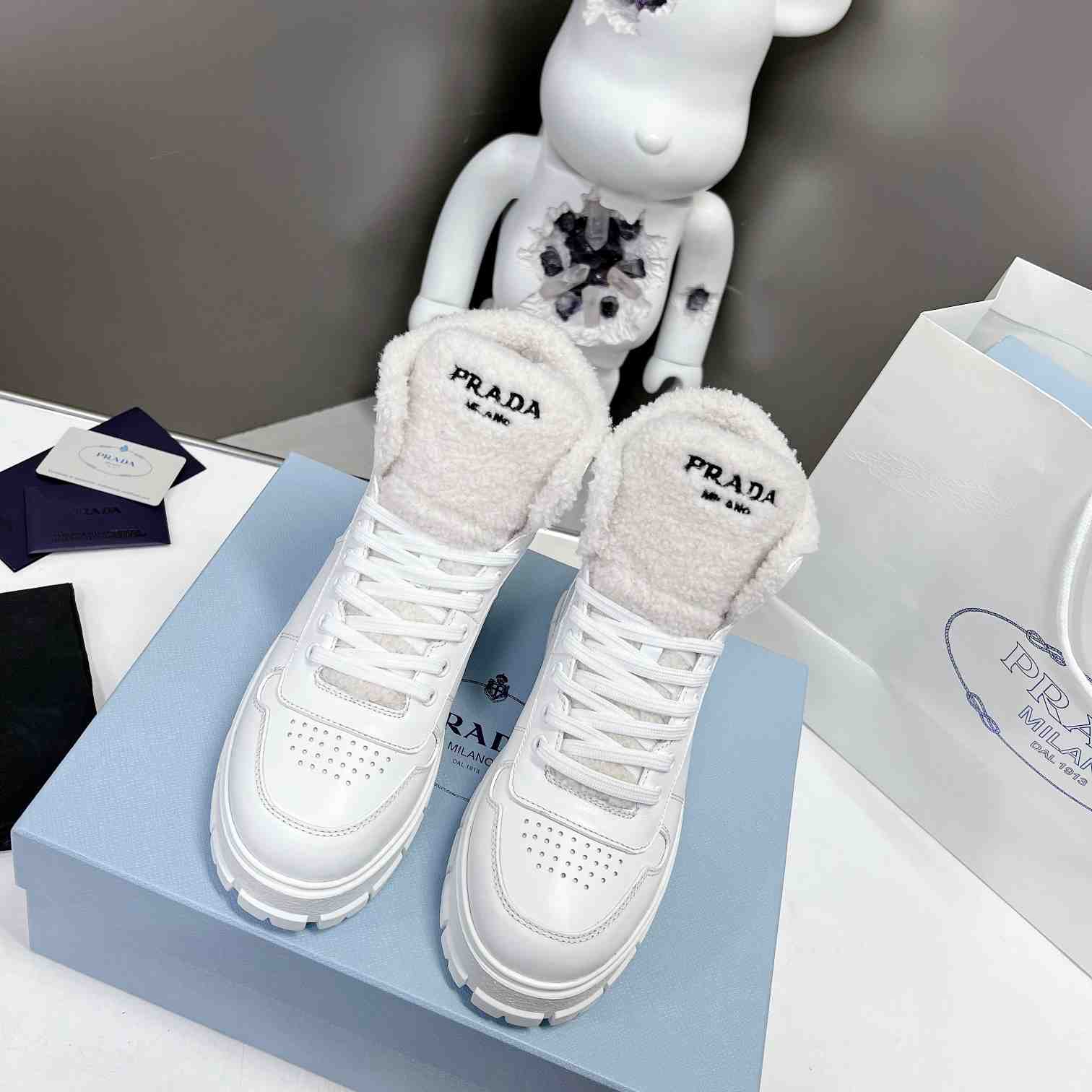 Prada Leather And Shearling High-top Sneakers - DopestKickz