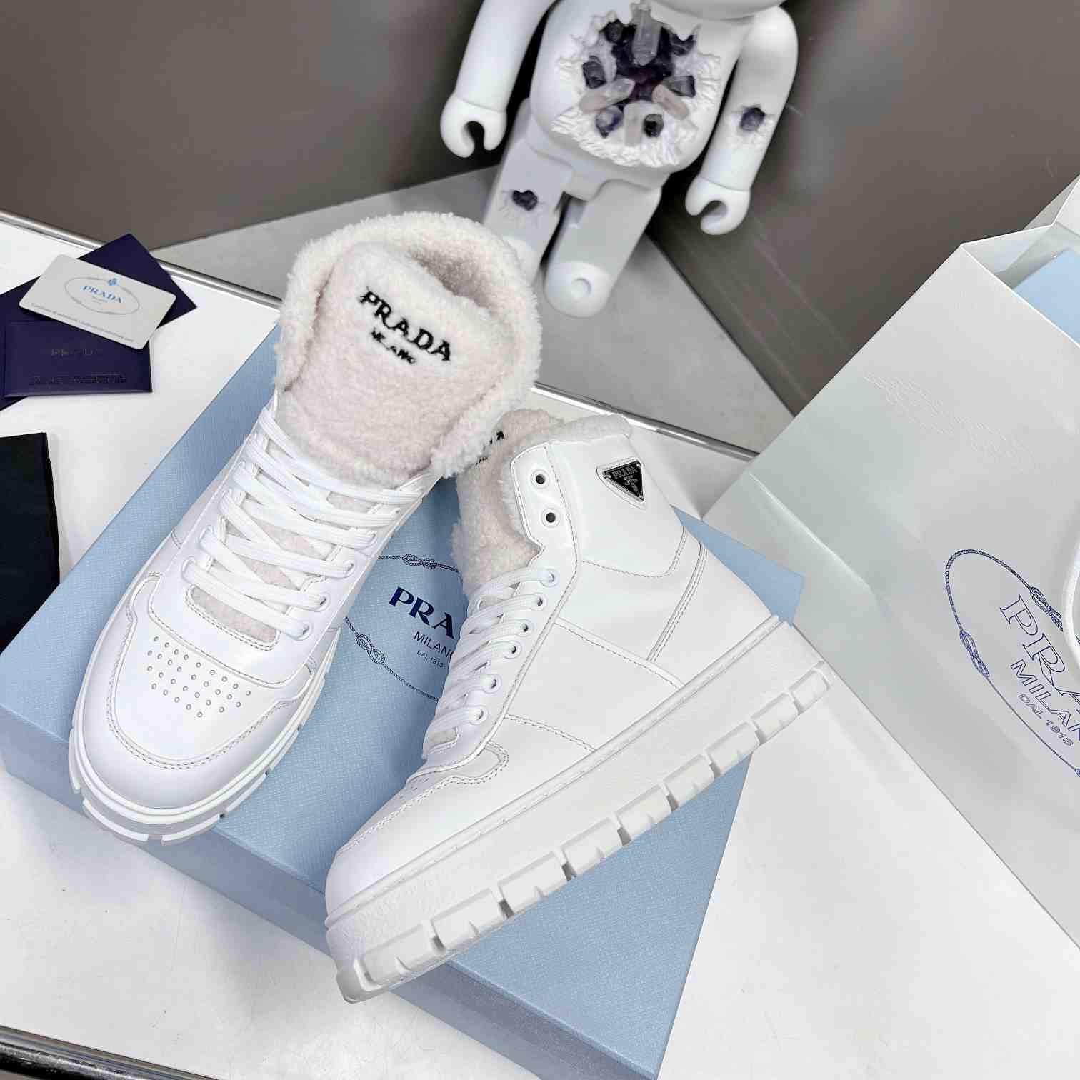 Prada Leather And Shearling High-top Sneakers - DopestKickz