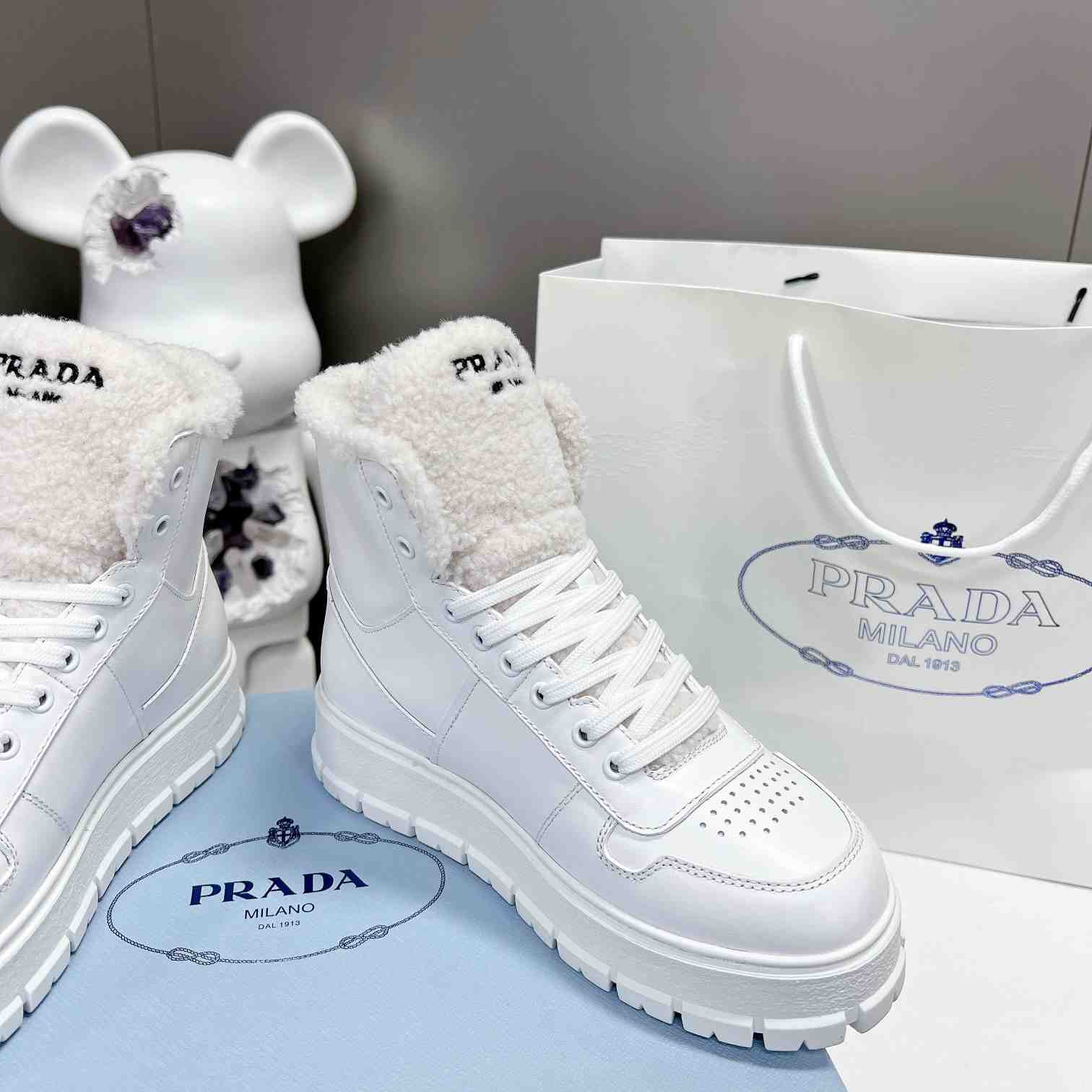 Prada Leather And Shearling High-top Sneakers - DopestKickz