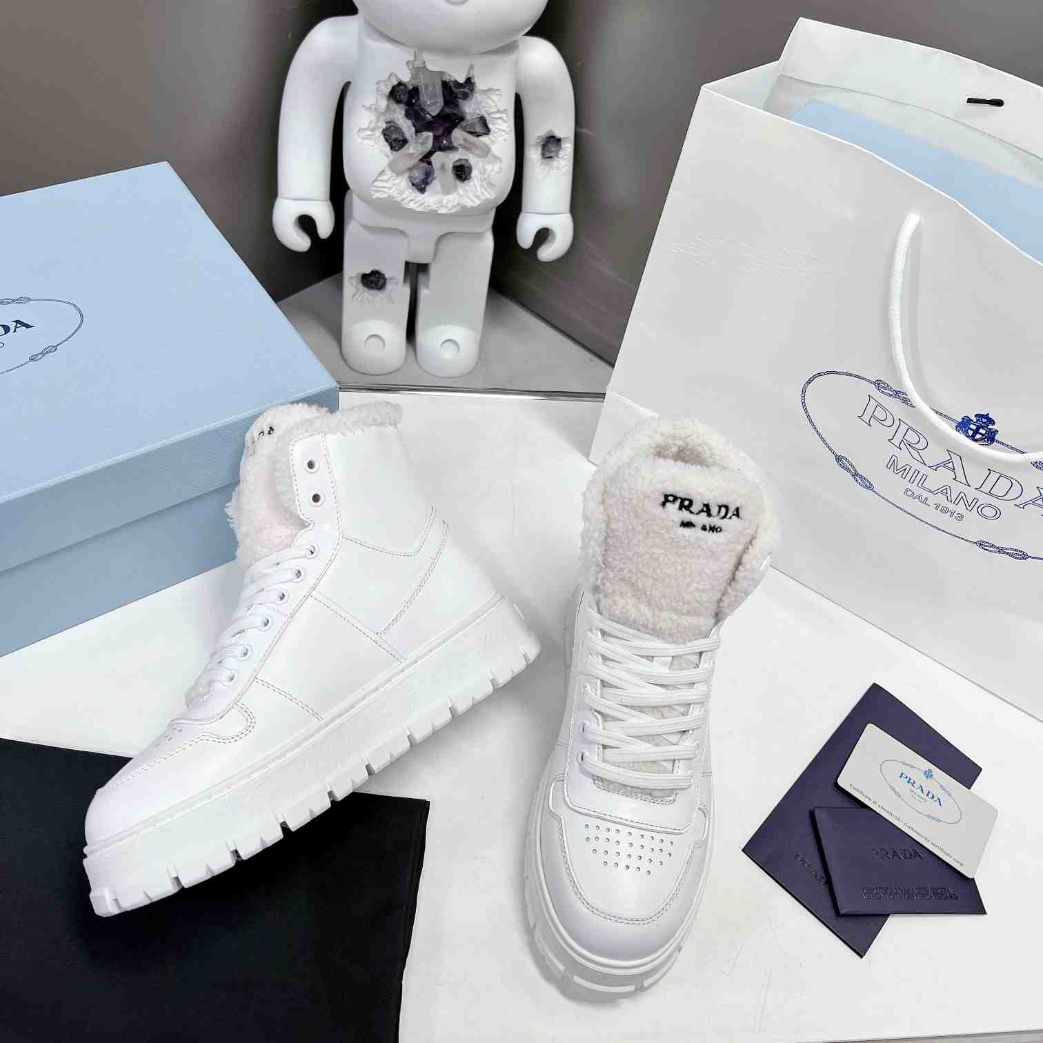 Prada Leather And Shearling High-top Sneakers - DopestKickz