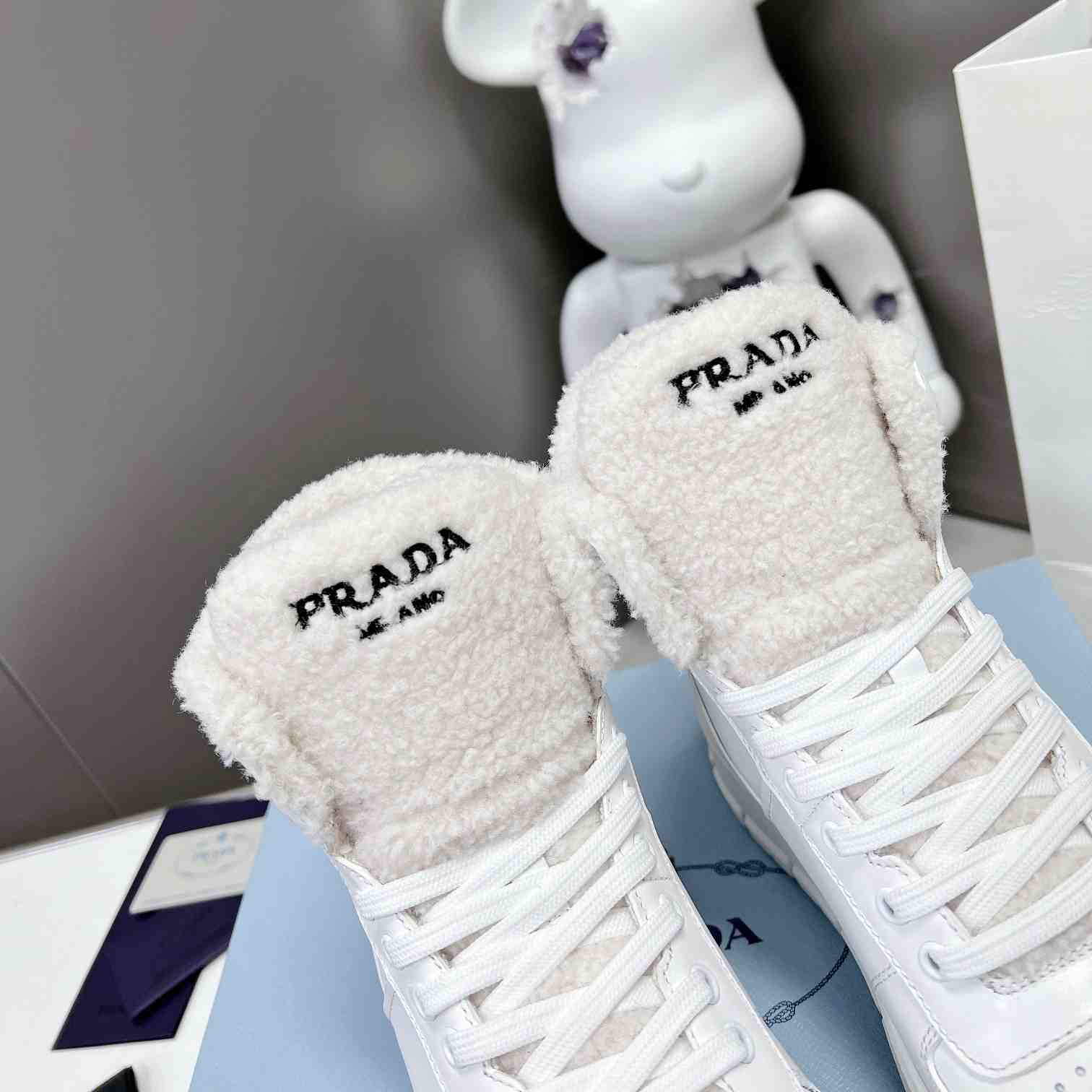 Prada Leather And Shearling High-top Sneakers - DopestKickz