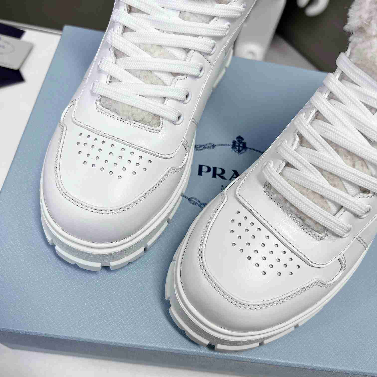 Prada Leather And Shearling High-top Sneakers - DopestKickz