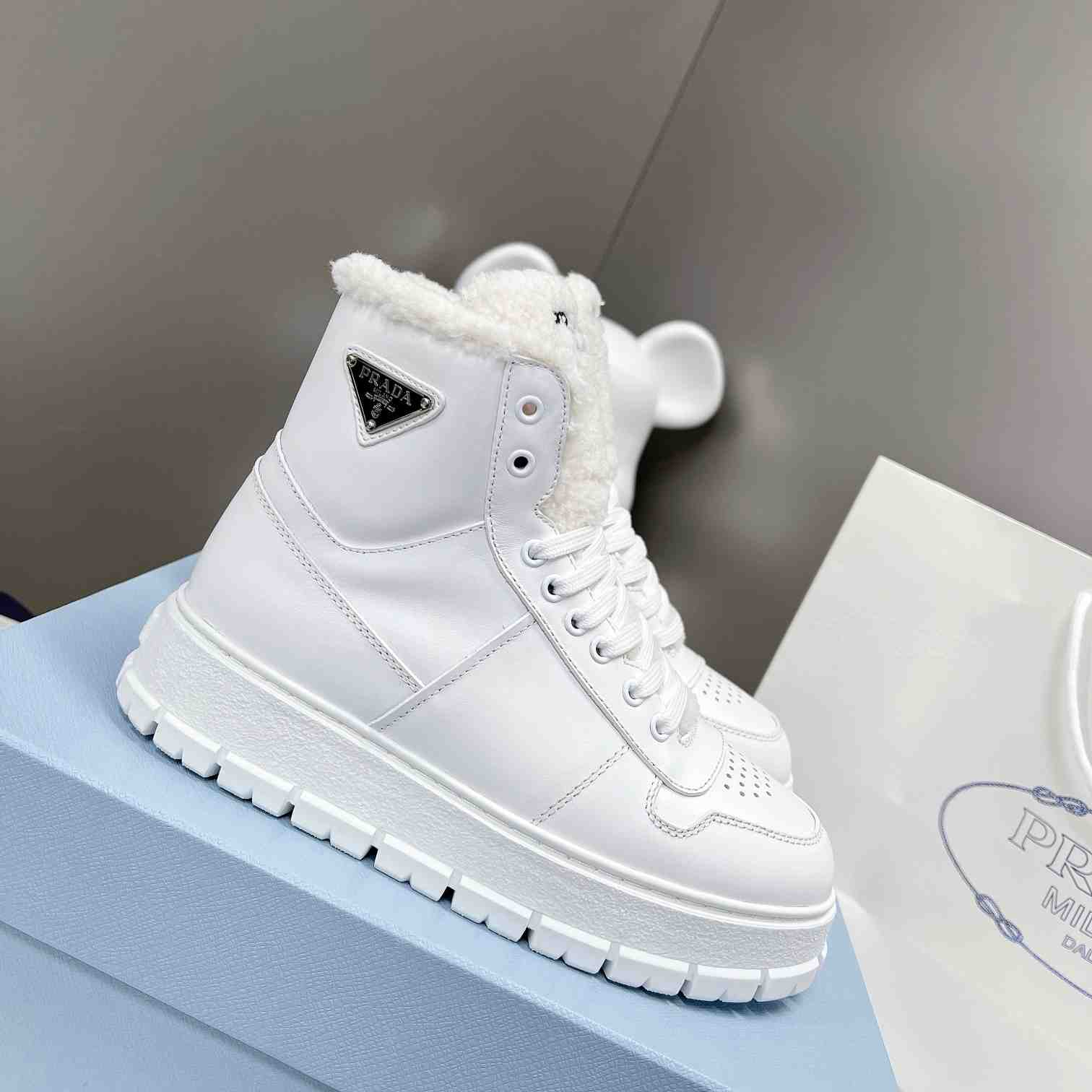 Prada Leather And Shearling High-top Sneakers - DopestKickz