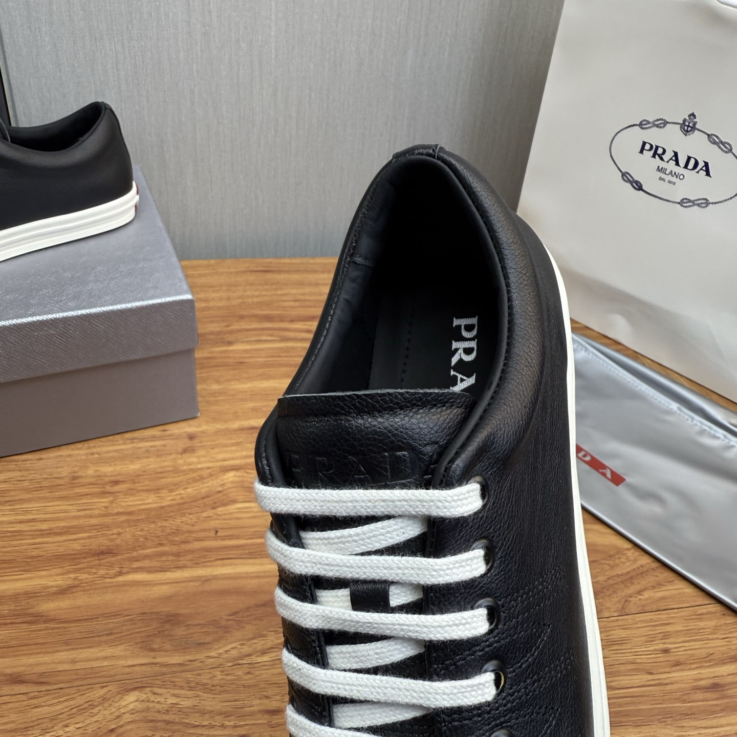 Prada Aged-Effect Lace-Up Low-Top Sneakers - DopestKickz