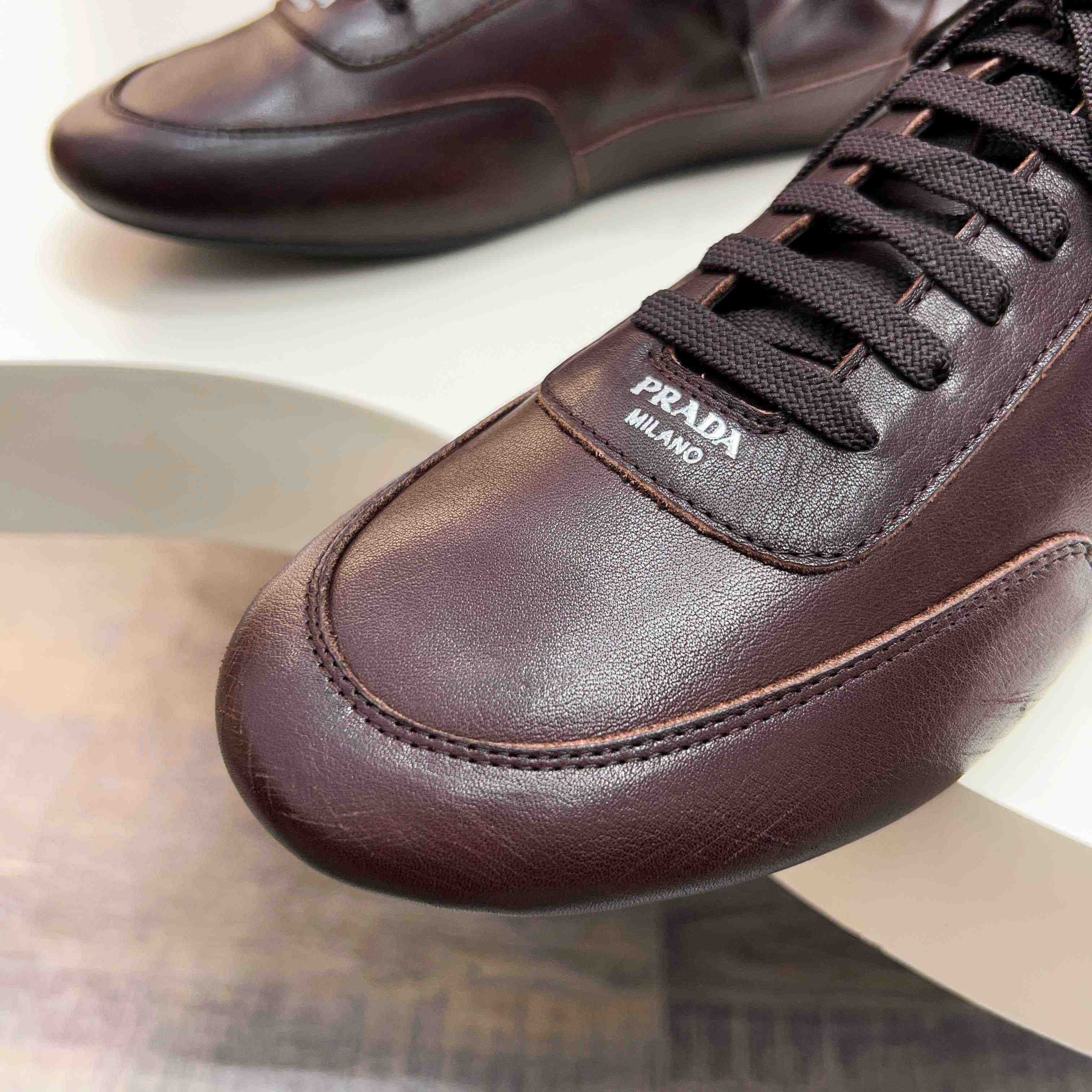 Prada Collapse Leather Sneakers - DopestKickz